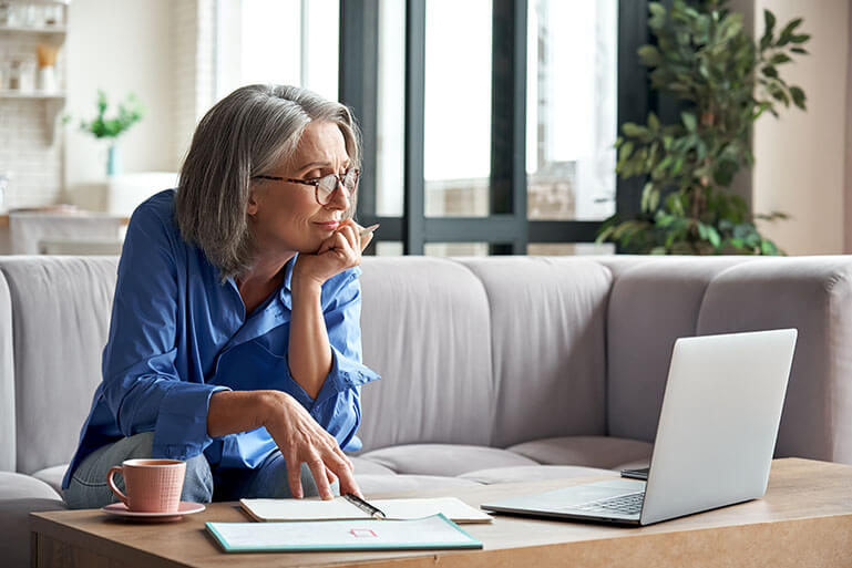 Woman Looking at Her Laptop Computer